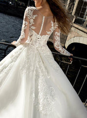 Illusion Neck A Line Wedding Dress with Long Sleeves and Sweep Train crafted from Lace and Tulle